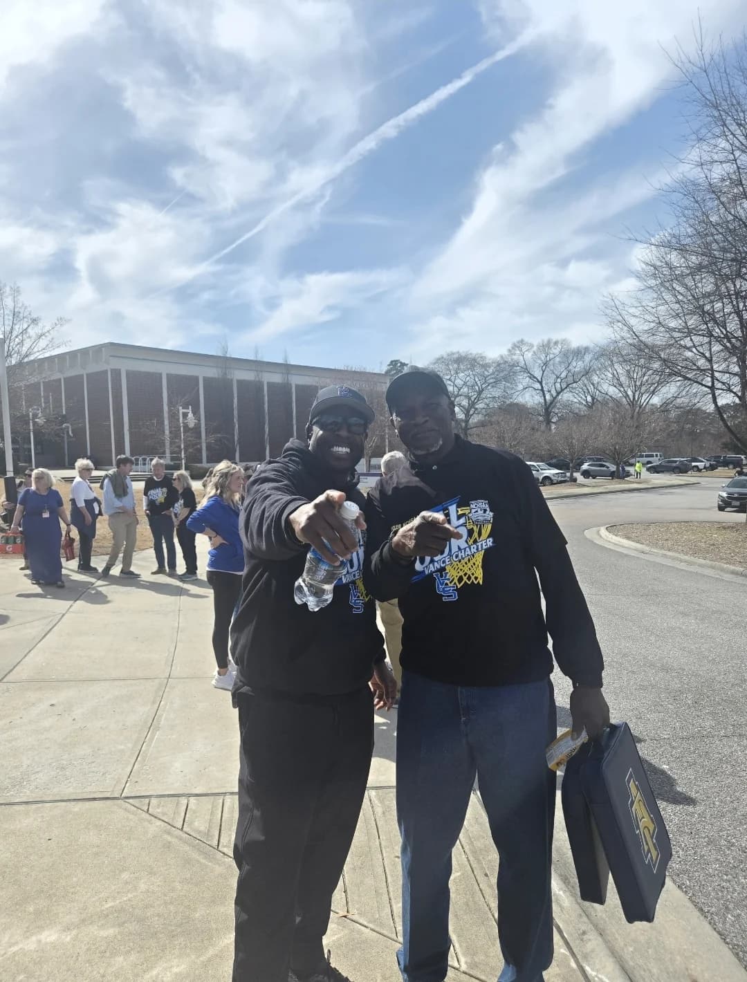 CJ Turrentine with a community member outdoors