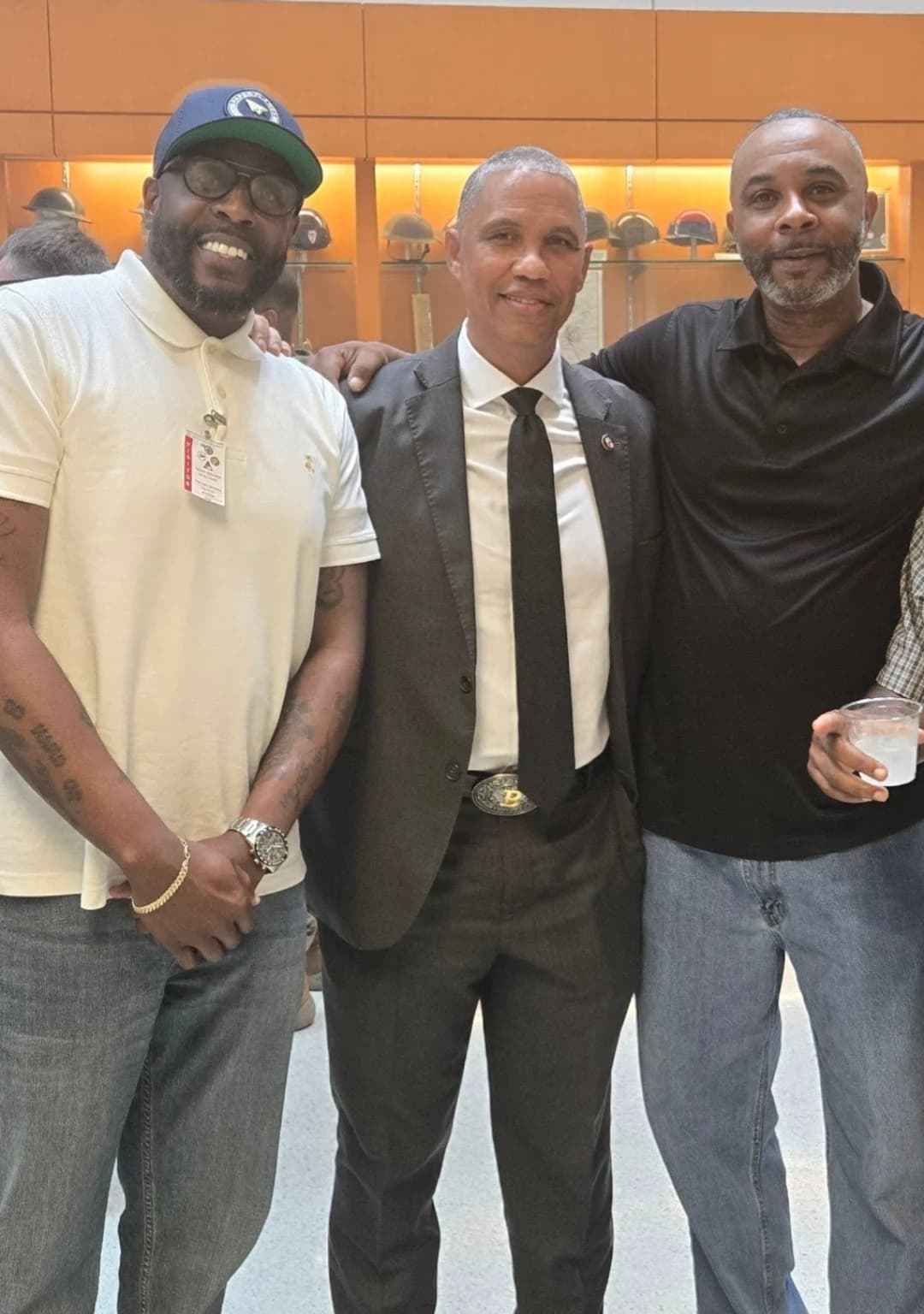 CJ Turrentine with two community leaders at an event